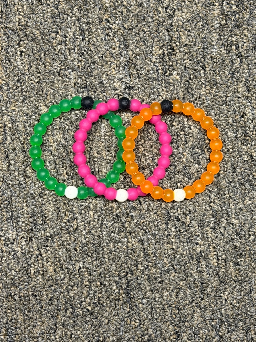 3 Lokai Bracelets: Nature Conservancy, Mental Health, Breast Cancer Awareness.